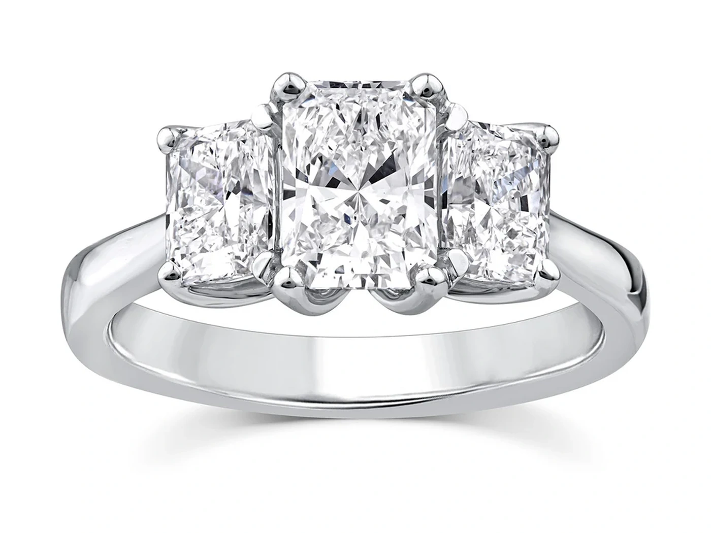 Three-stone trilogy engagement ring in white gold